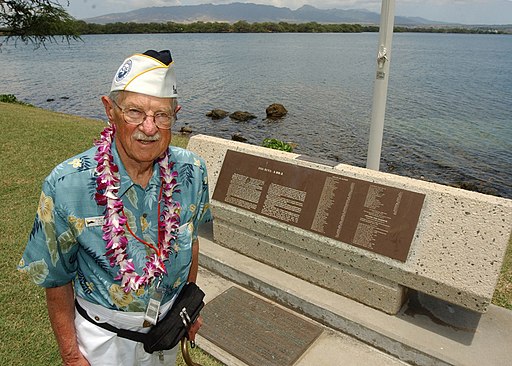 US Navy 030530-N-3994W-002 Retired Chief Warrant Officer Henry White poses at the USS Nevada (BB 36) Memorial during a recent visit to Hospital Point