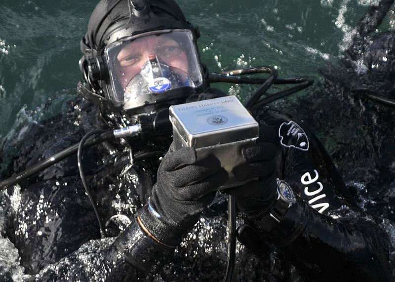 Diver placing ashes inside the USS Arizona