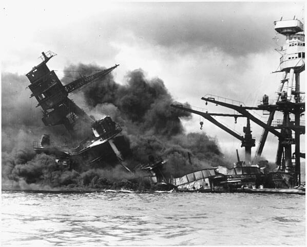 USS <em>Arizona</em> (BB-39) exploded and sank during the attack on Pearl Harbor. She was stricken from the Naval Vessel Register one year later