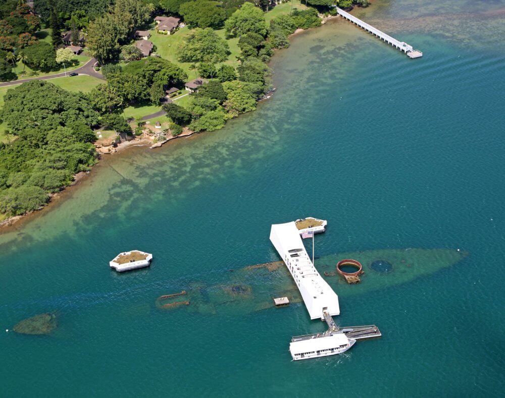 USS Arizona Memorial straddles the wreckage of the sunken battleship